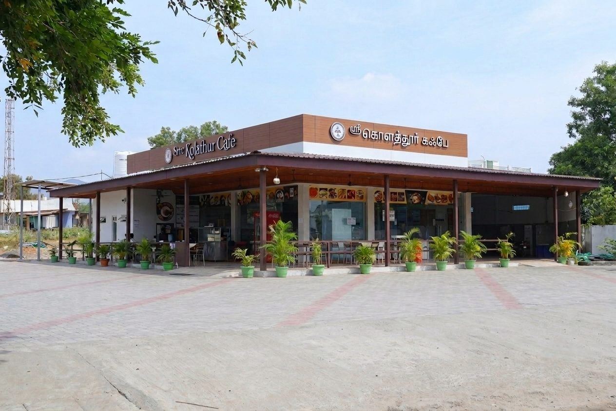 Front of Sree Kolathur Cafe at Four Roads, Kolathur, Mettur — tiled awning, signboard and outdoor seating